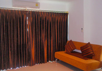 Fully air-conditioned condominium with individual temperature control and complete blind-out curtains in Pattaya Thailand.