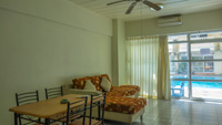 Living Room of condominium for rent in Niran Condo, fully furnished with sofa, dining table and much more.