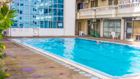 Pattaya condo for rent with large outdoor swimming pool. Simply step out of your apartment to the pool in Nirun Grand Ville.